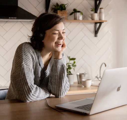 Image of a woman smiling while video-calling